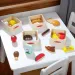 Melissa &amp; Doug: Set de joacă din lemn cu alimente în lăzi - Spin Master